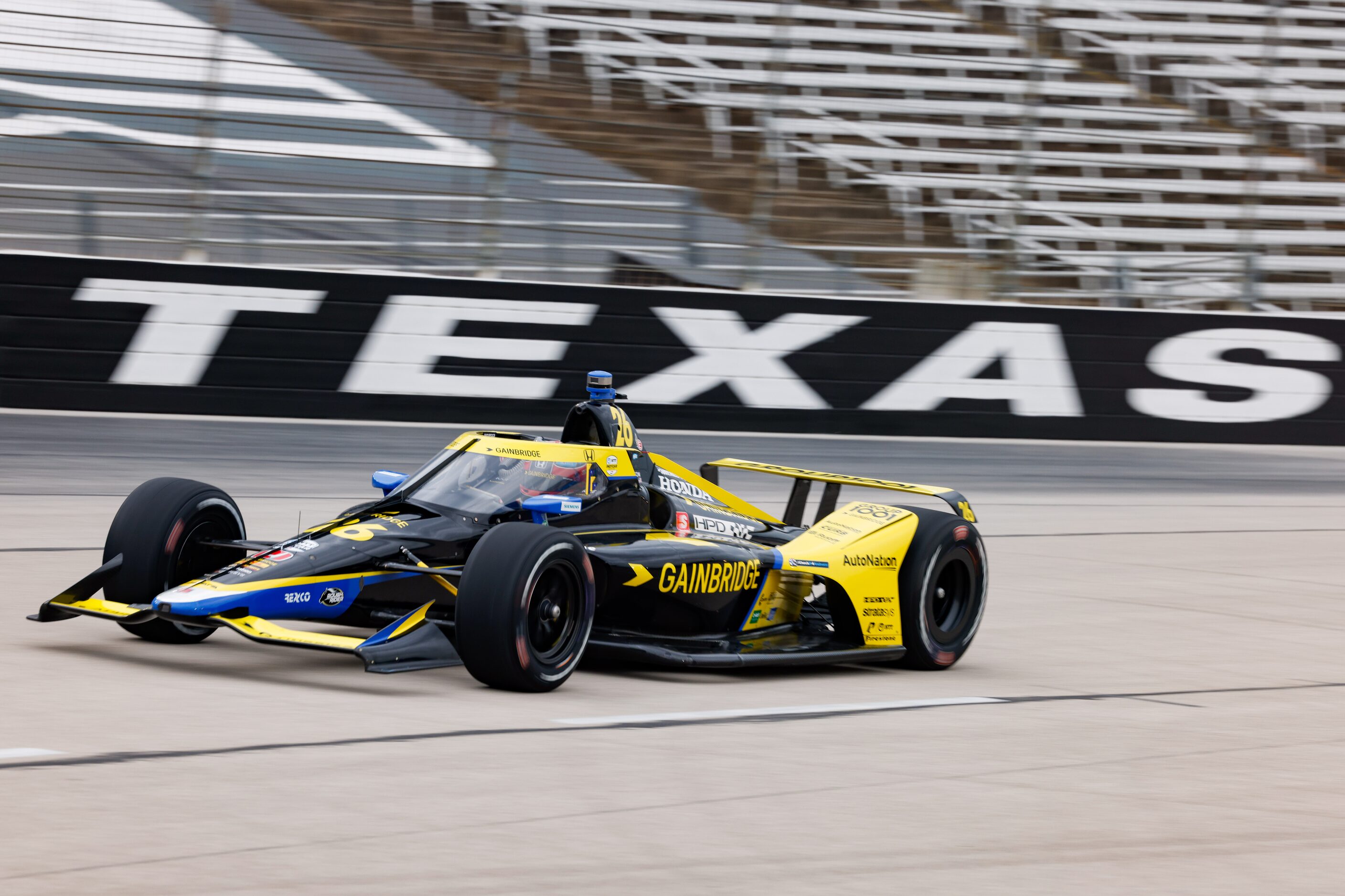 Colton Herta (#26) races during the IndyCar Genesys 300 at Texas Motor Speedway on Saturday,...