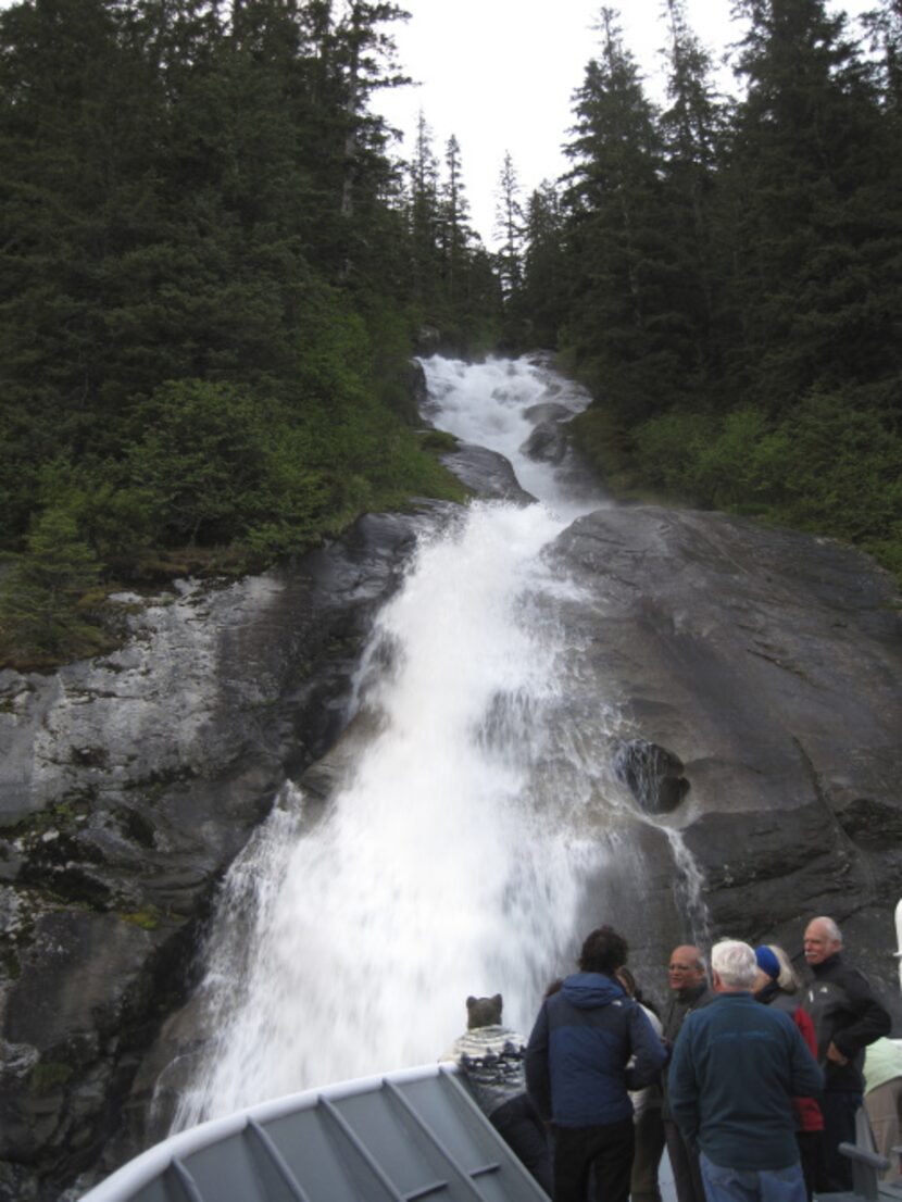 Guests and naturalists mingle on the deck for a close look at the Hole in the Wall...