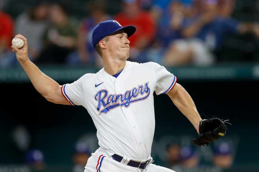 Texas Rangers starting pitcher Glenn Otto (49) delivers the ball during the first inning of...