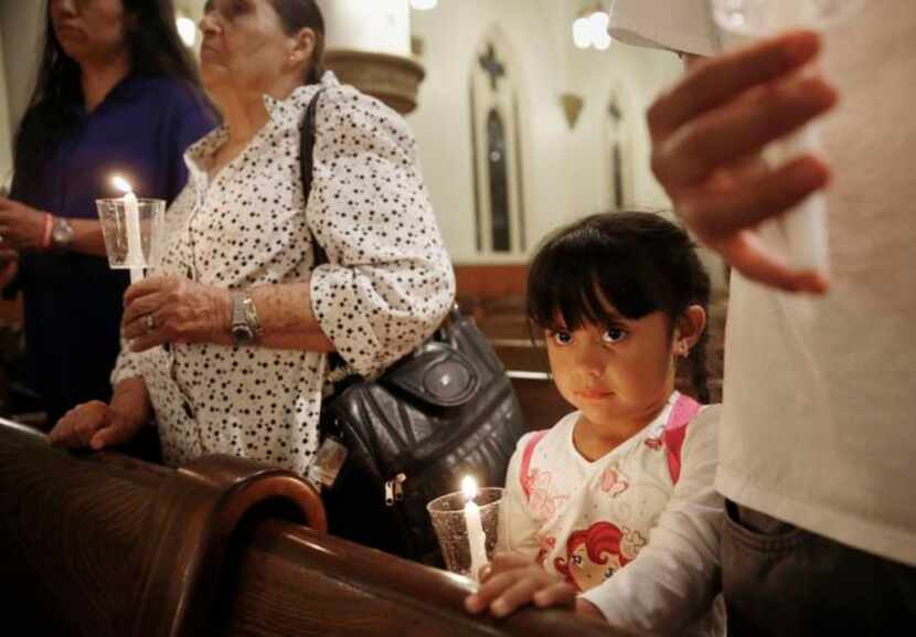 
Evelin Garcia, 4, along with (from left) her mother, Esthela Estrada; her grandmother,...