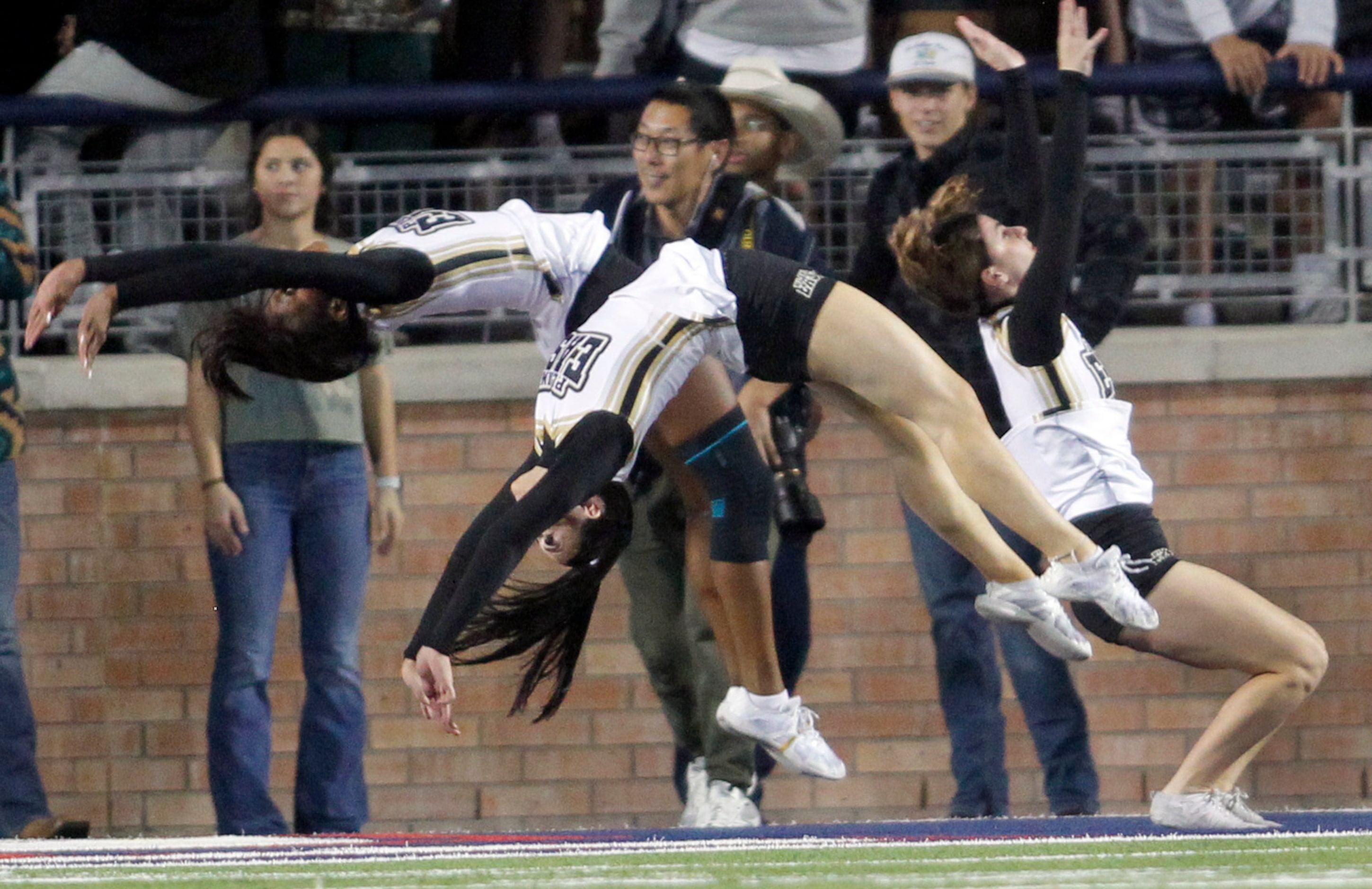 Plano East cheerleaders flip over a Panthers touchdown during first half action against...