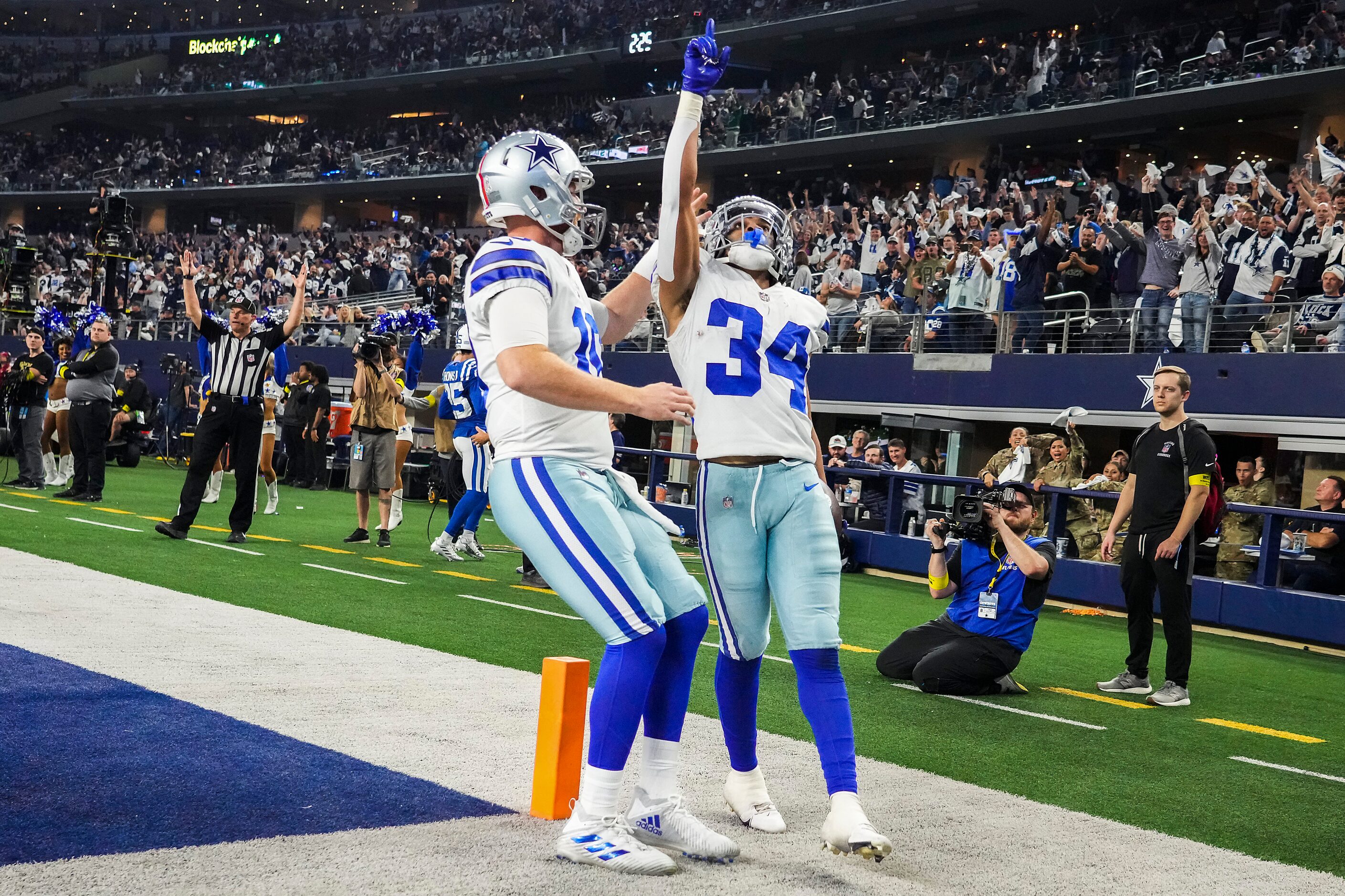 Dallas Cowboys running back Malik Davis (34) celebrates with quarterback Cooper Rush (10)...