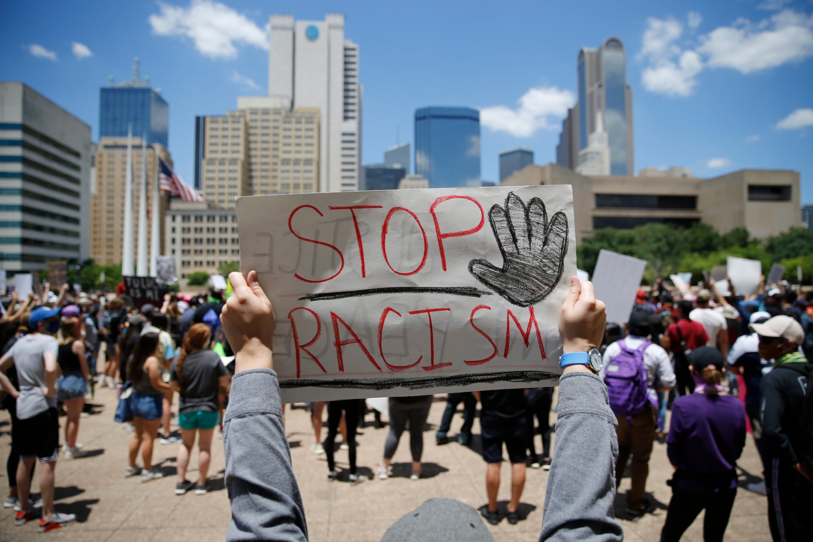 Protesters rally during a demonstration against police brutality in downtown Dallas, on...