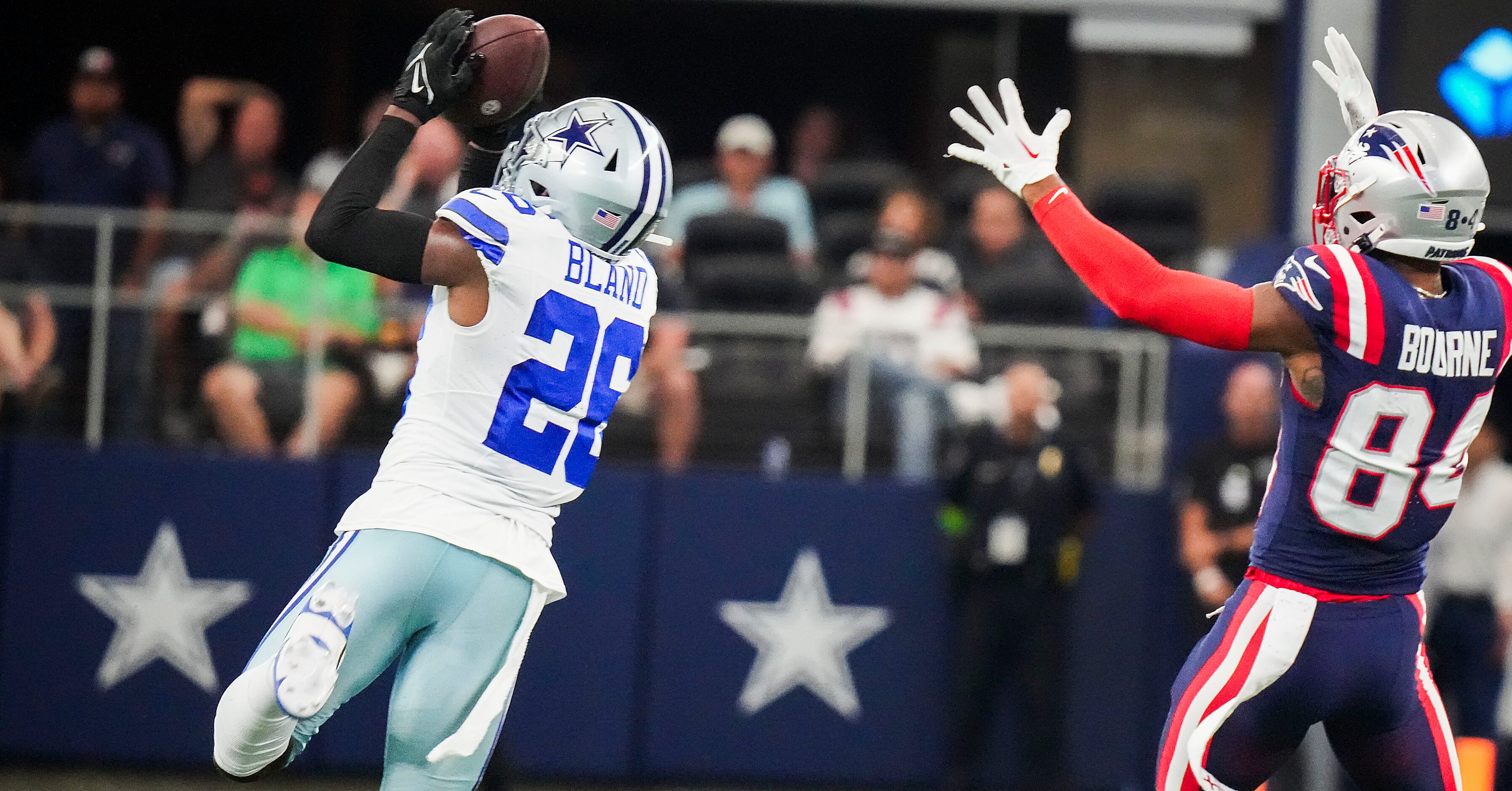 Dallas Cowboys cornerback DaRon Bland (26) intercepts a pass intended for New England...