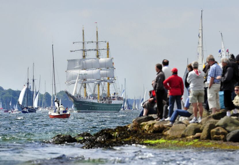 Visitors watch the "Alexander von Humboldt II" tall ship at the Windjammer Parade of tall...