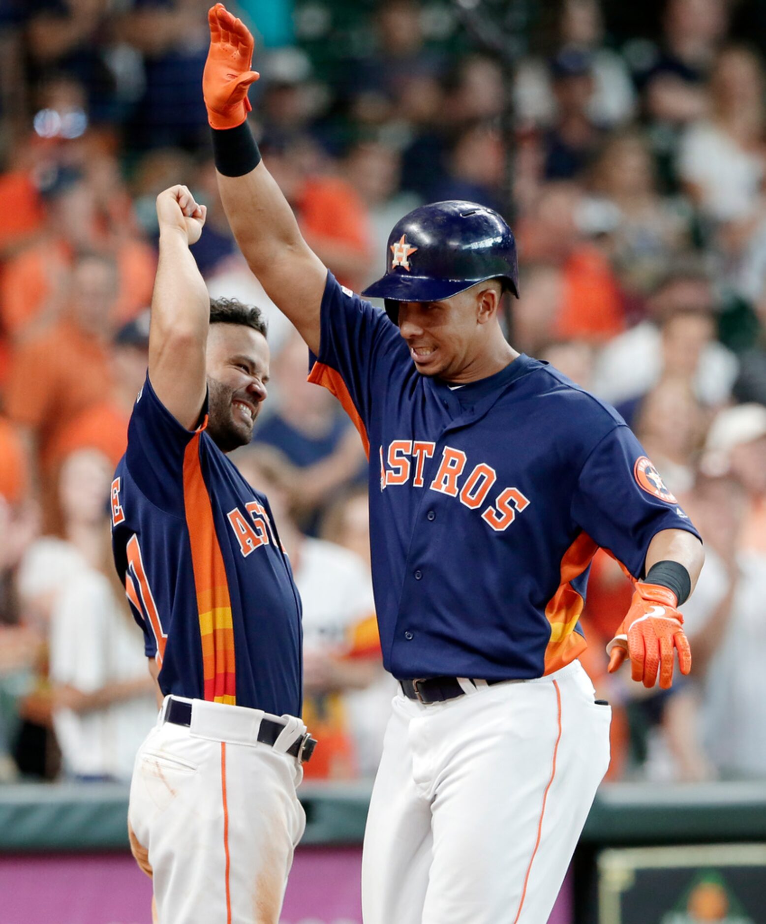 Houston Astros Jose Altuve, left, and Michael Brantley, right, celebrate Brantley's home run...