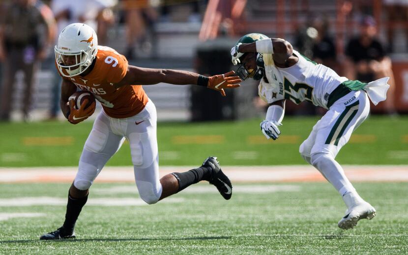 Texas Longhorns wide receiver Collin Johnson (9) gets away from Baylor Bears cornerback...