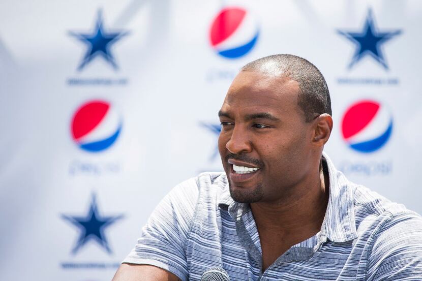 Former Dallas Cowboys player Darren Woodson addresses a press conference announcing him as...