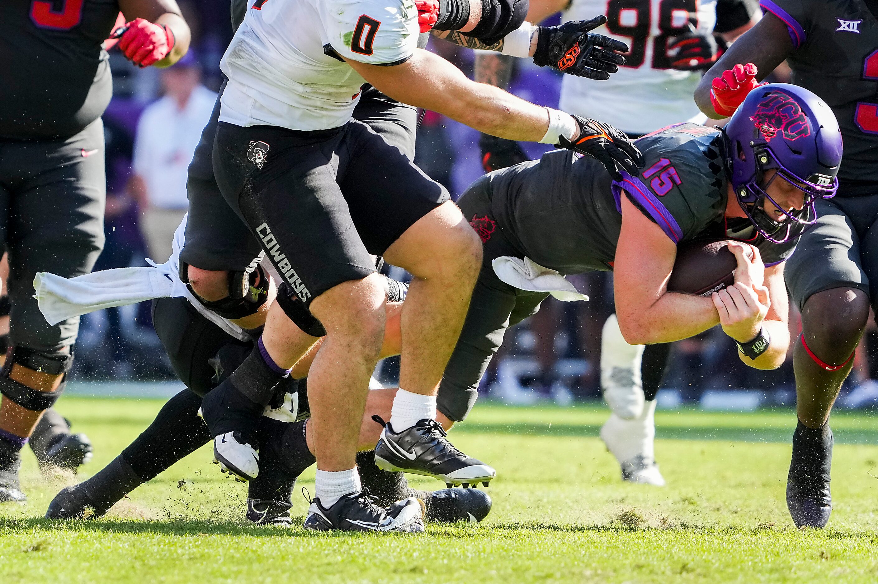 TCU quarterback Max Duggan (15) dives for a first down during the first half of an NCAA...