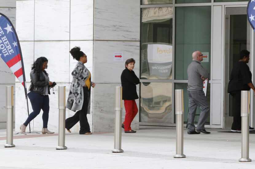 People walk into the George L. Allen, Sr. Courts Building in Dallas at 600 Commerce St on...