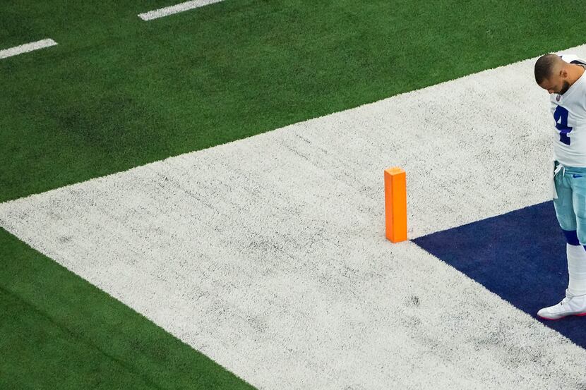 Dallas Cowboys quarterback Dak Prescott stands alone in the corner of the end zone before an...