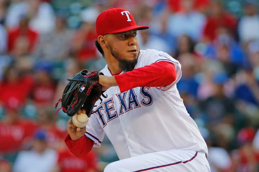 Texas Rangers pitcher Yovani Gallardo throws a first inning pitch during the Los Angeles...
