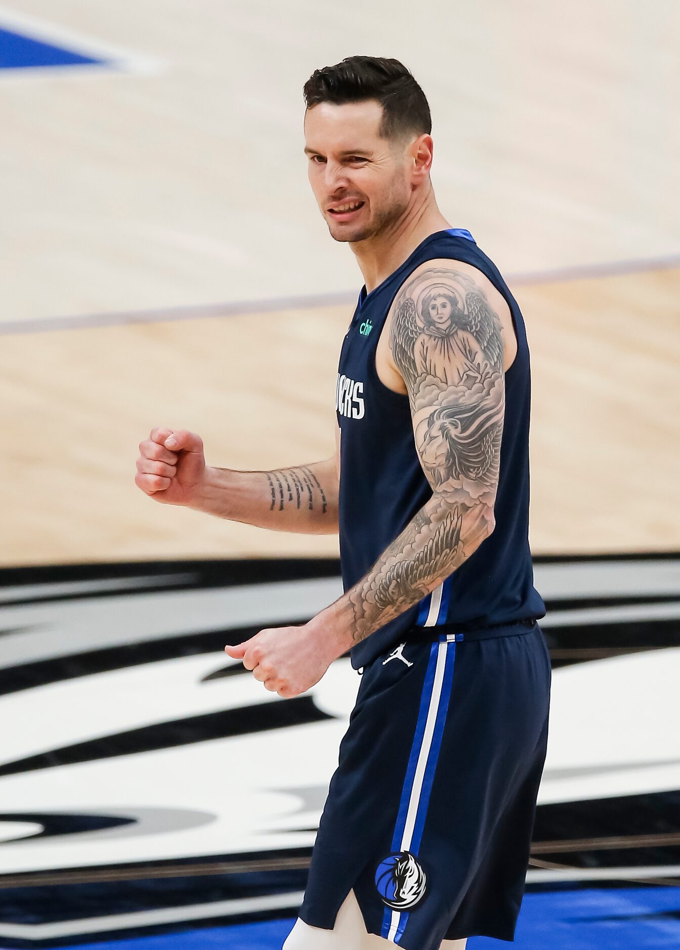 Dallas Mavericks guard JJ Redick (17) reacts to a foul against the Philadelphia 76ers during...