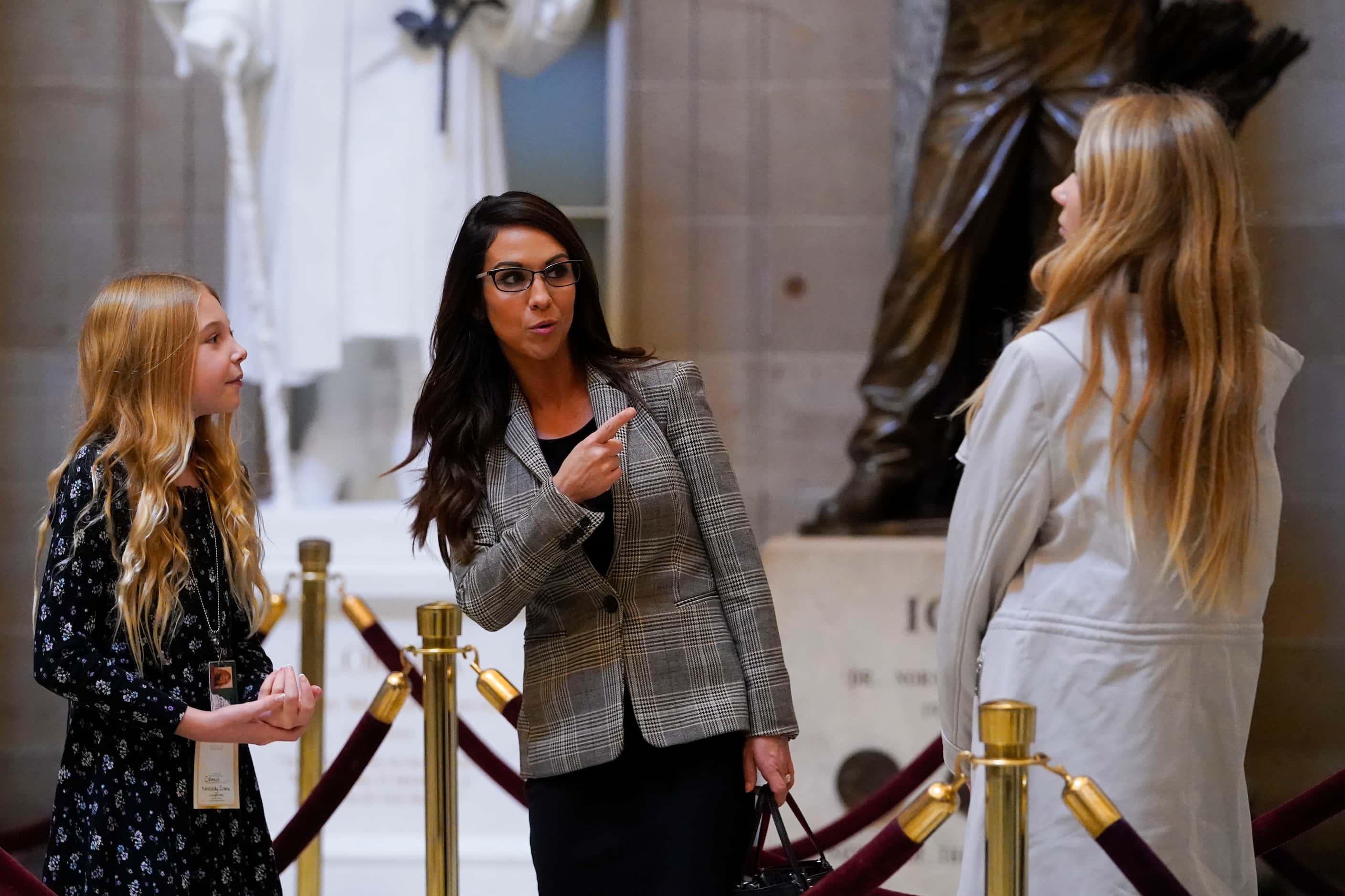 Rep. Lauren Boebert, R-Colo., center, gives a tour of Statuary Hall as the House meets for...