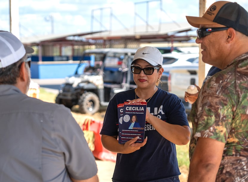 Cecilia Castellano, center, talks with voters during a barbecue cook-off in Poteet, Texas on...