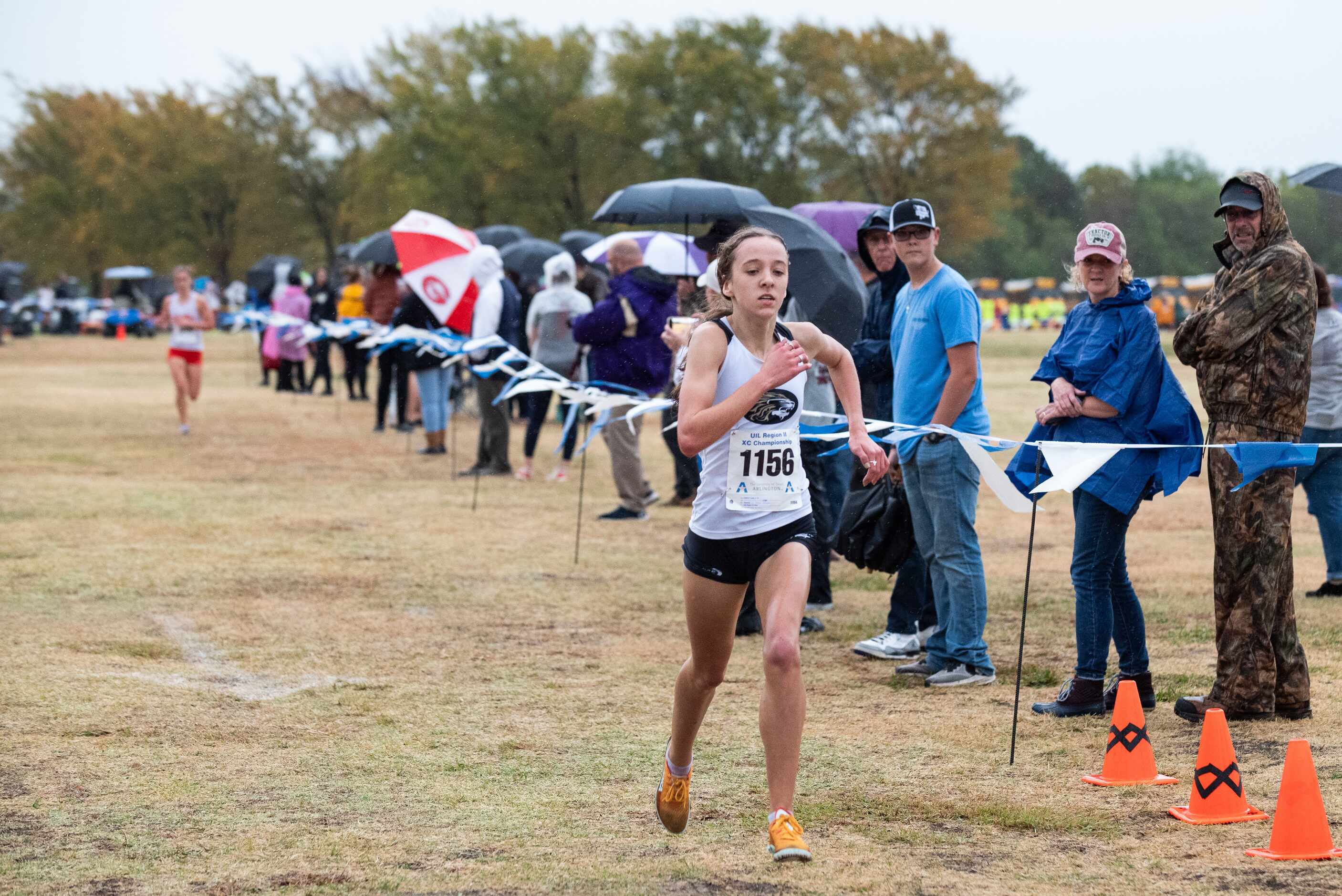 Kaufman sophomore Kathryn Tucker crosses the finish line to win the 4A Girls UIL Region II...