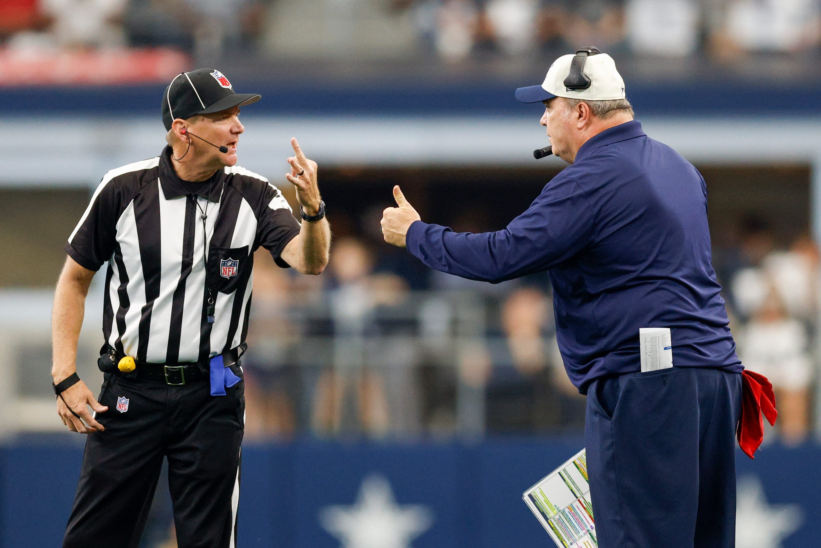 Dallas Cowboys head coach Mike McCarthy talks with an official during the second half of a...