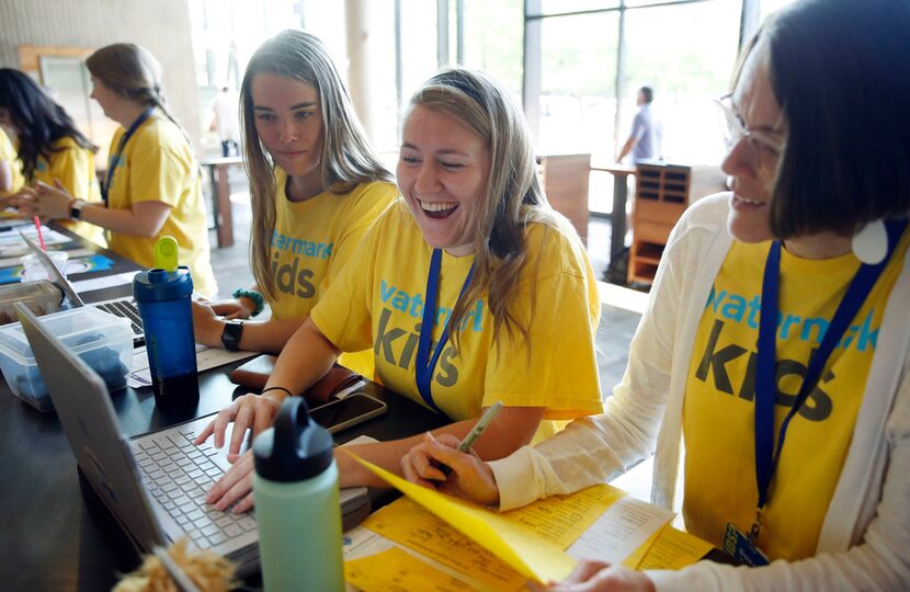 From left: Mary Claire Carrick, Amy Gammenthaler and Suzanne Sanderson share in a laugh as...