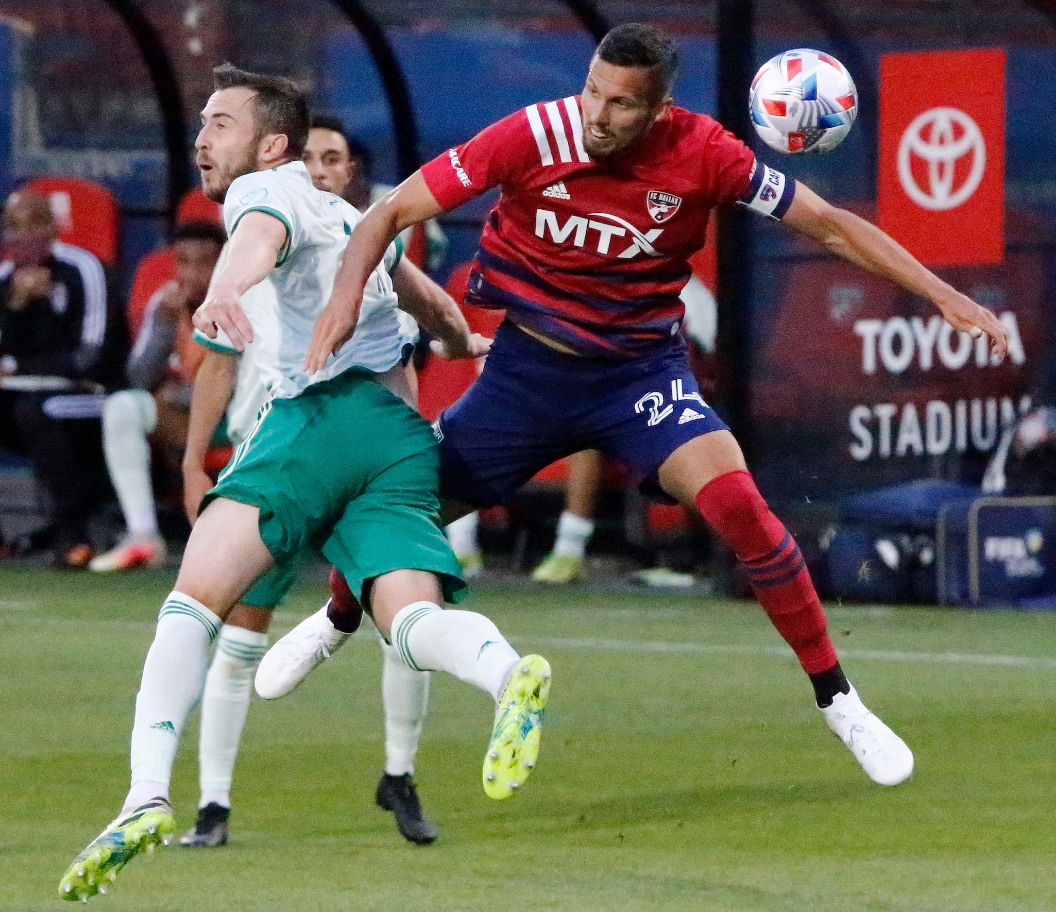 FC Dallas defender Matt Hedges (24) and Colorado Rapids defender Danny Wilson (4) battle for...