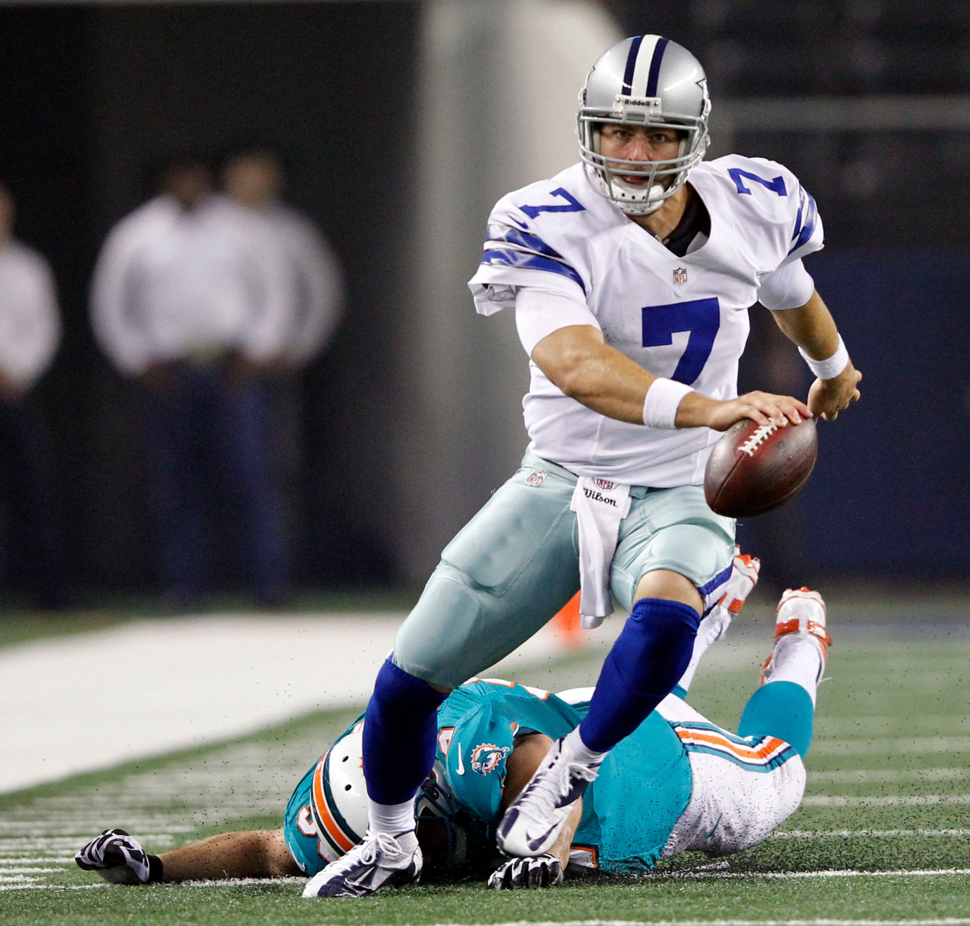 Dallas Cowboys quarterback Stephen McGee (7) tries to take the ball down  field in the first half of their pre-season footbal…