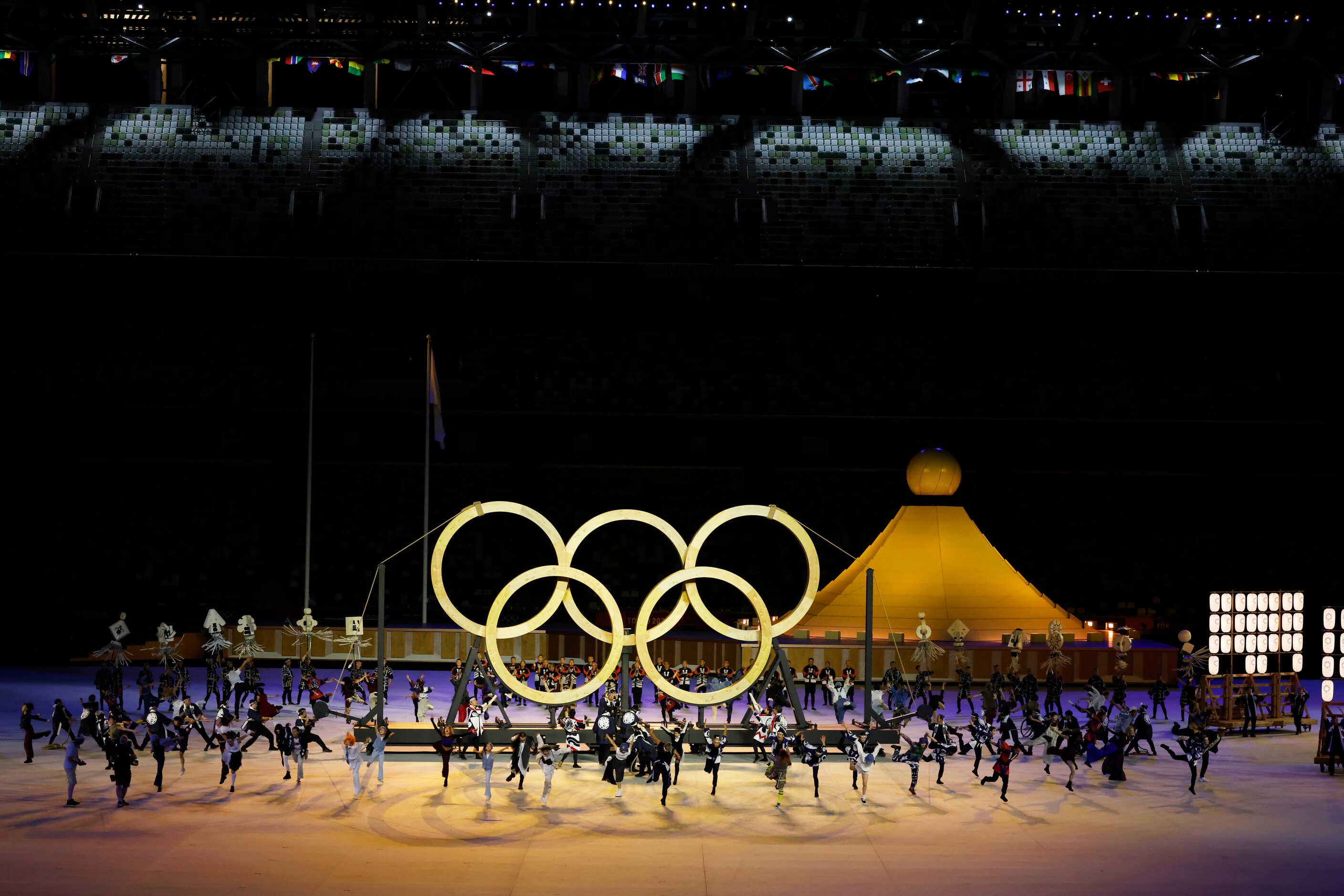 Entertainers perform during the opening ceremony for the postponed 2020 Tokyo Olympics at...