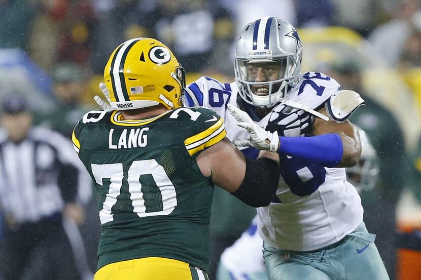 Dallas Cowboys defensive end Greg Hardy (76) tries get around Green Bay Packers guard T.J....