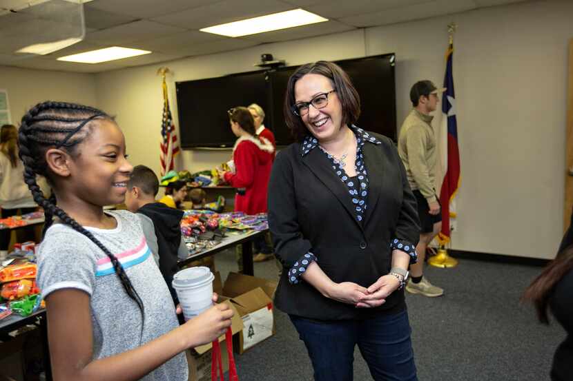 MJ Hegar chats with Azaria Jordan, 9, and her stepmother, Staff Sgt. Selina Robinson during...