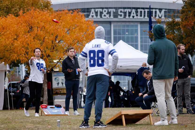 Dallas Cowboys fans Trent Sanger of Dallas (facing left) and Blaine Shawaker of Dallas play...