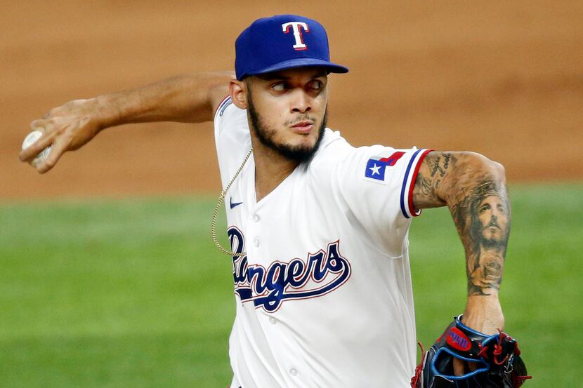 Texas Rangers relief pitcher Jonathan Hernandez (72) throws during the eighth inning against...