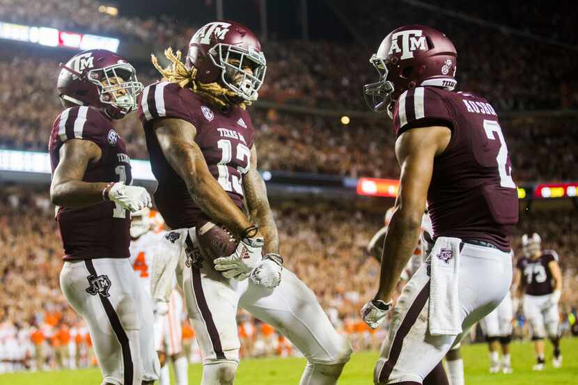 FILE - Texas A&M Aggies wide receiver Kendrick Rogers (13) celebrates after scoring a...