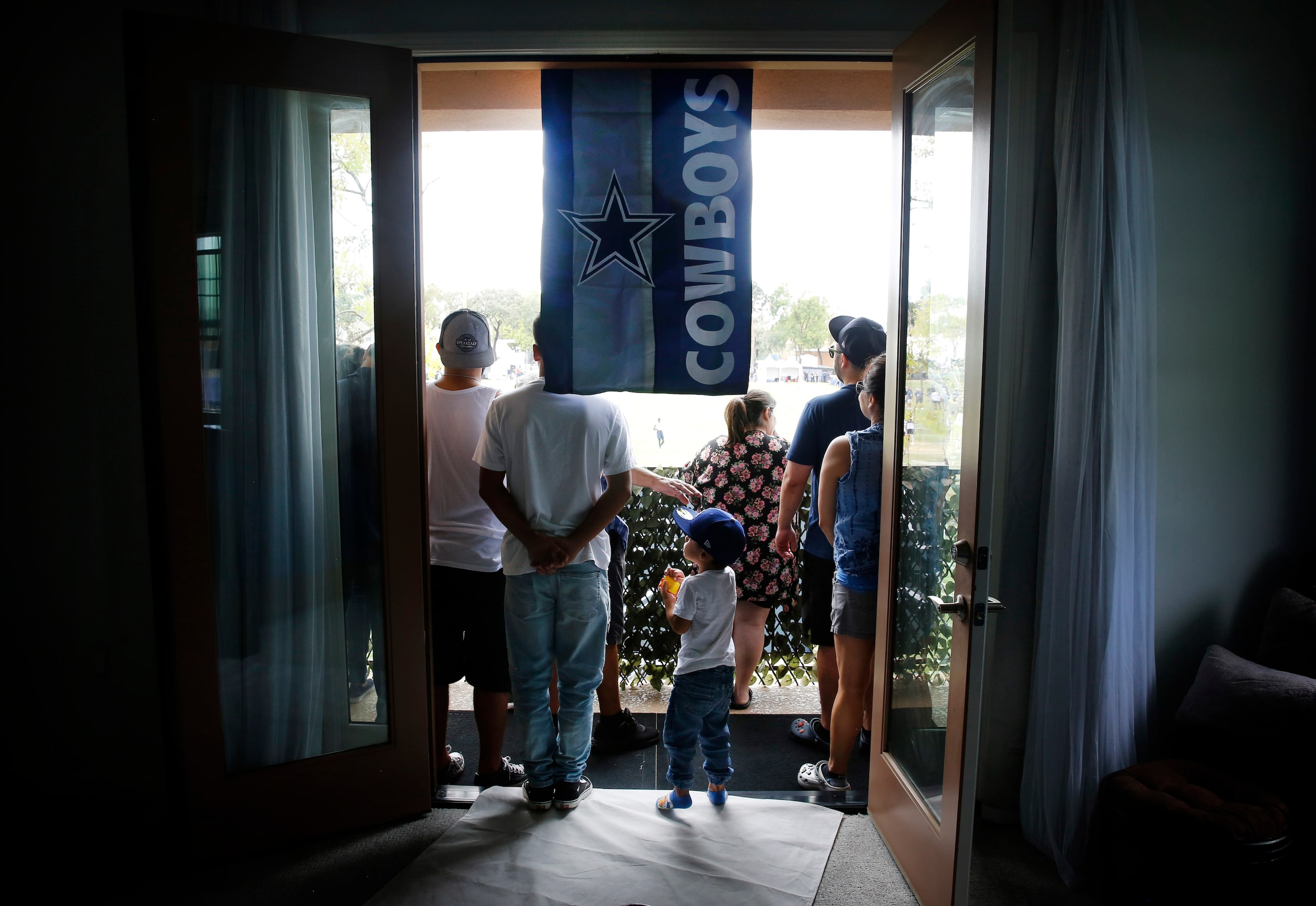 The Acosta family, including three year-old Nico Garcia watched the Dallas Cowboys training...