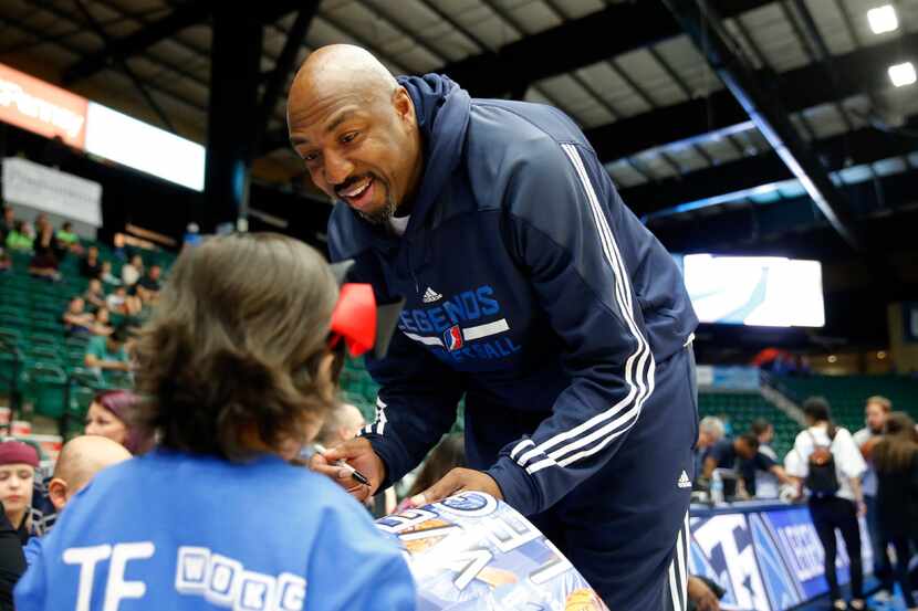 Joselyn Iniguez, 7 of Bridgeport gets an autograph from 
former NBA star, Vin Baker, a...