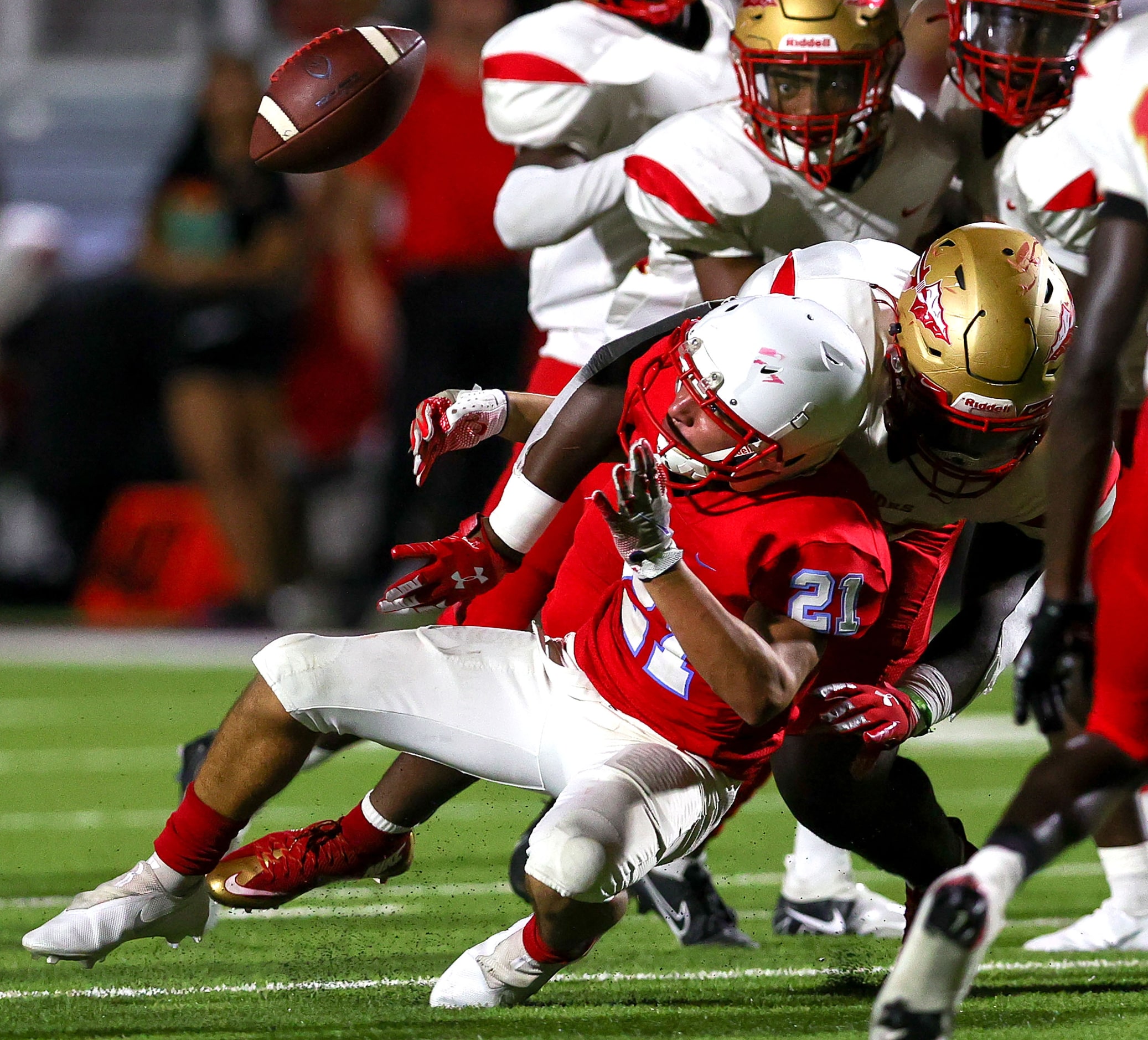 Skyline running back Joel Facundo (21) fumbles the ball against South Grand Prairie during...