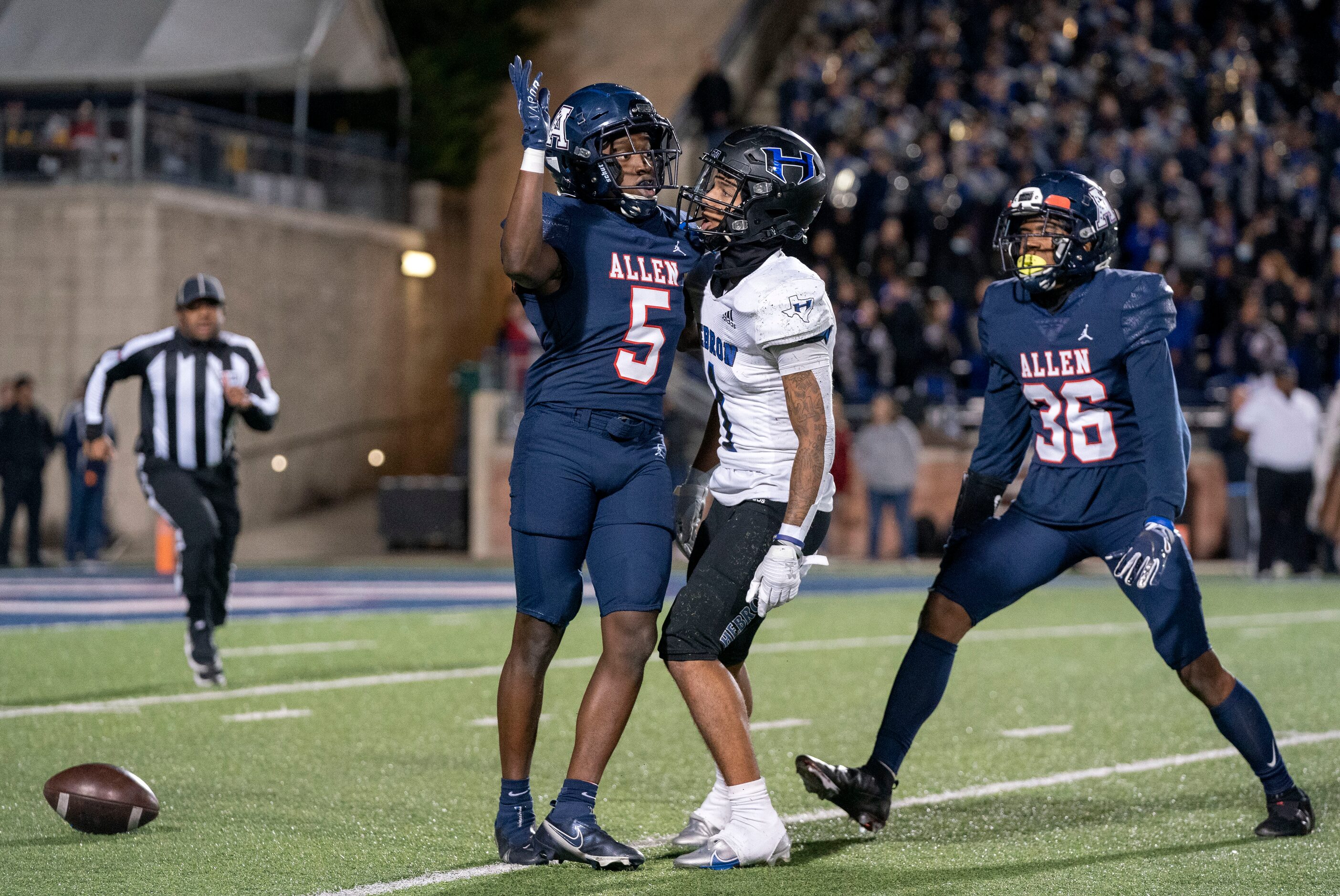 Allen senior defensive back Sign Shuva (5) and Hebron wide receiver Takoda Bridges (1)...