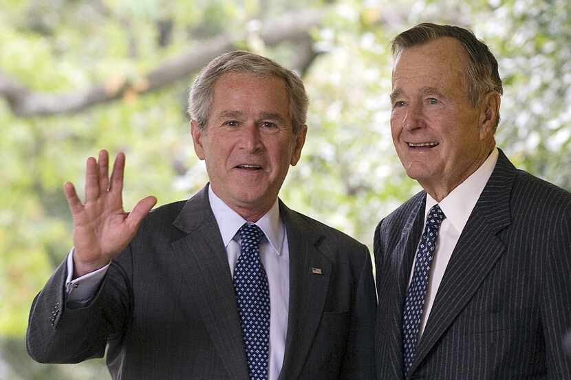 In this file photo taken on September 25, 2008, President George W. Bush waved as he walks...