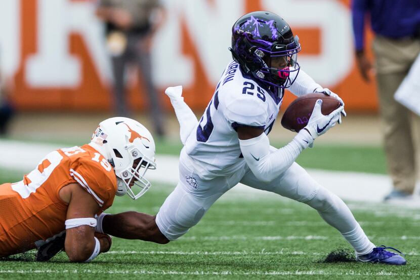 TCU Horned Frogs wide receiver KaVontae Turpin (25) is tackled by Texas Longhorns defensive...