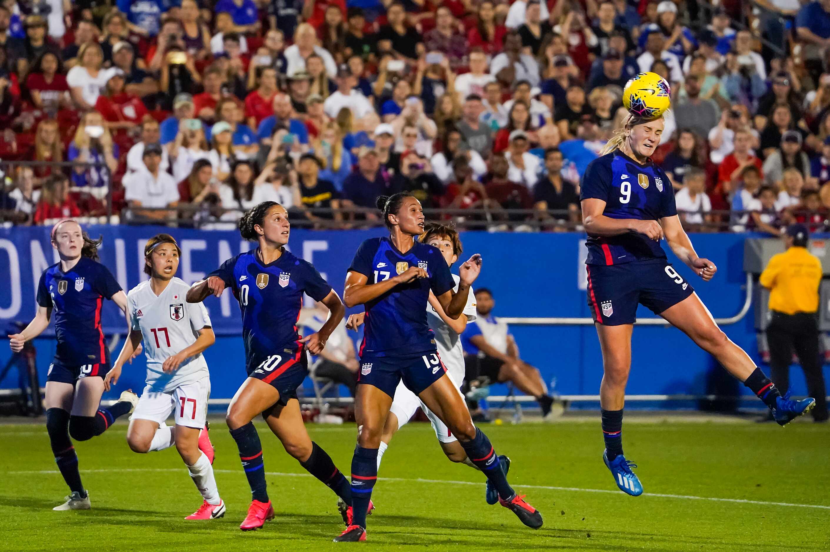 USA midfielder Lindsey Horan (9) heads the ball toward the goal during the second half of a...