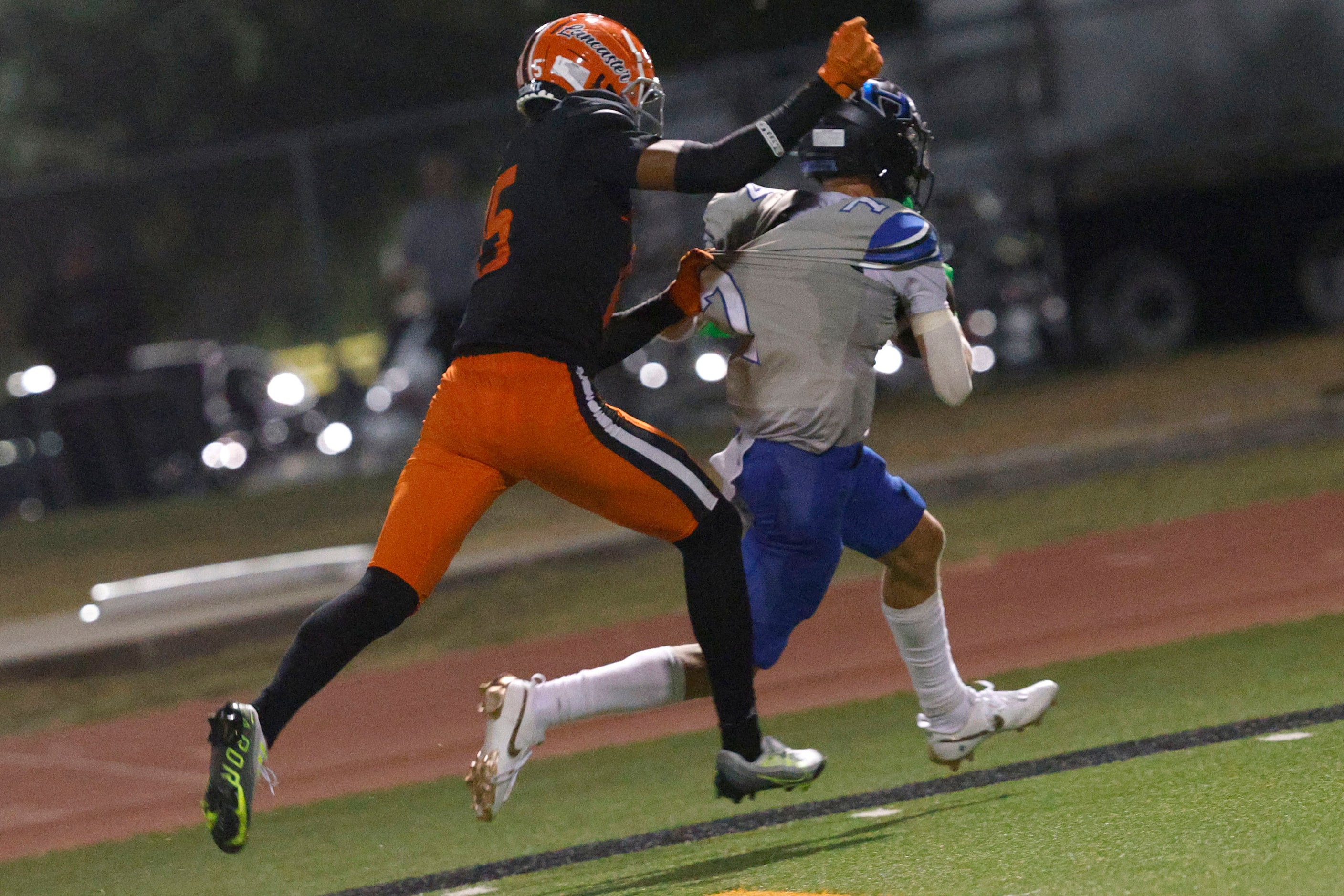 Hebron’s Tyler Hoke (7) runs into the end zone for a touchdown as Lancaster’s James Foster...