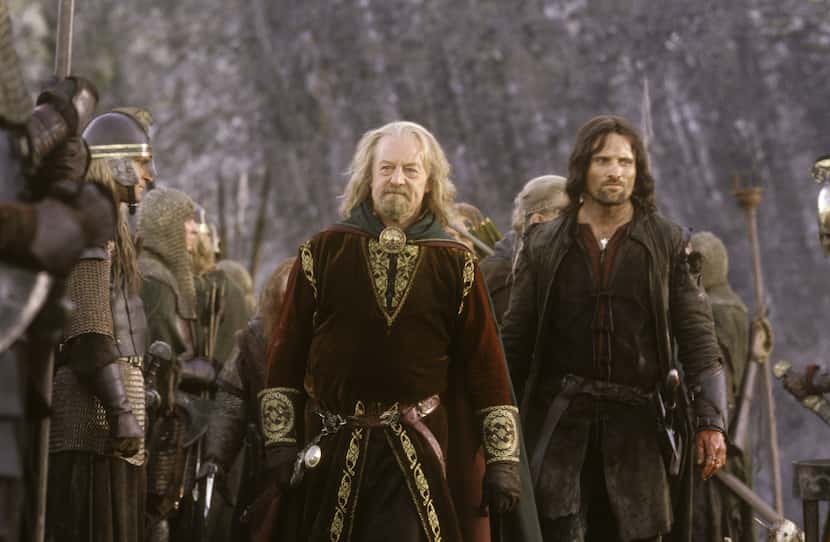 Bernard Hill (left) as 'King Theoden' inspects his Rohan troops with Viggo Mortensen as...