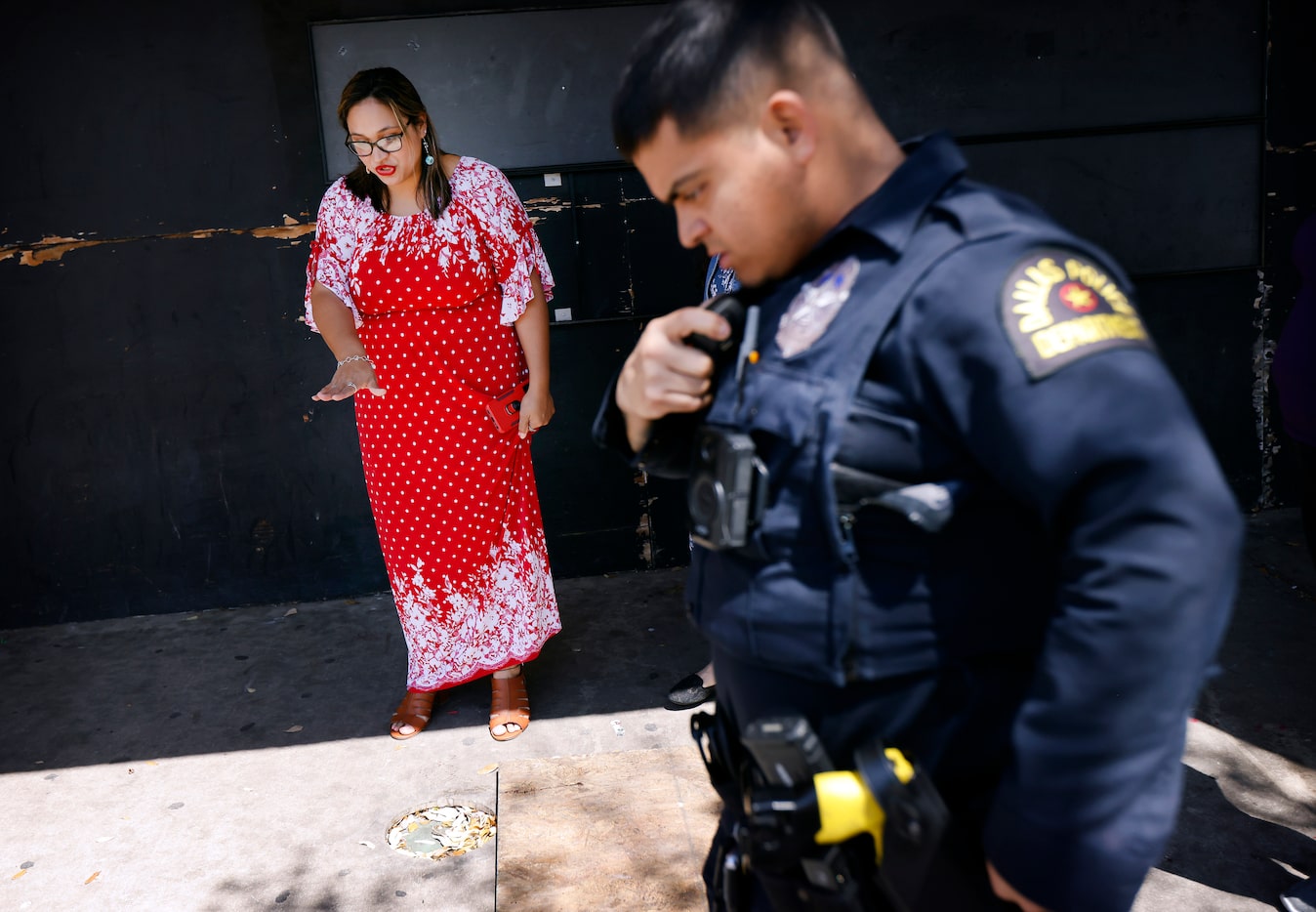 The Potter’s House Christian Fellowship Church member Norma Summers points out shell casings...