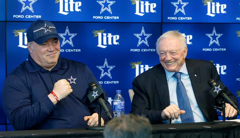 Dallas Cowboys head coach Mike McCarthy (left) makes a fist after owner Jerry Jones joked...