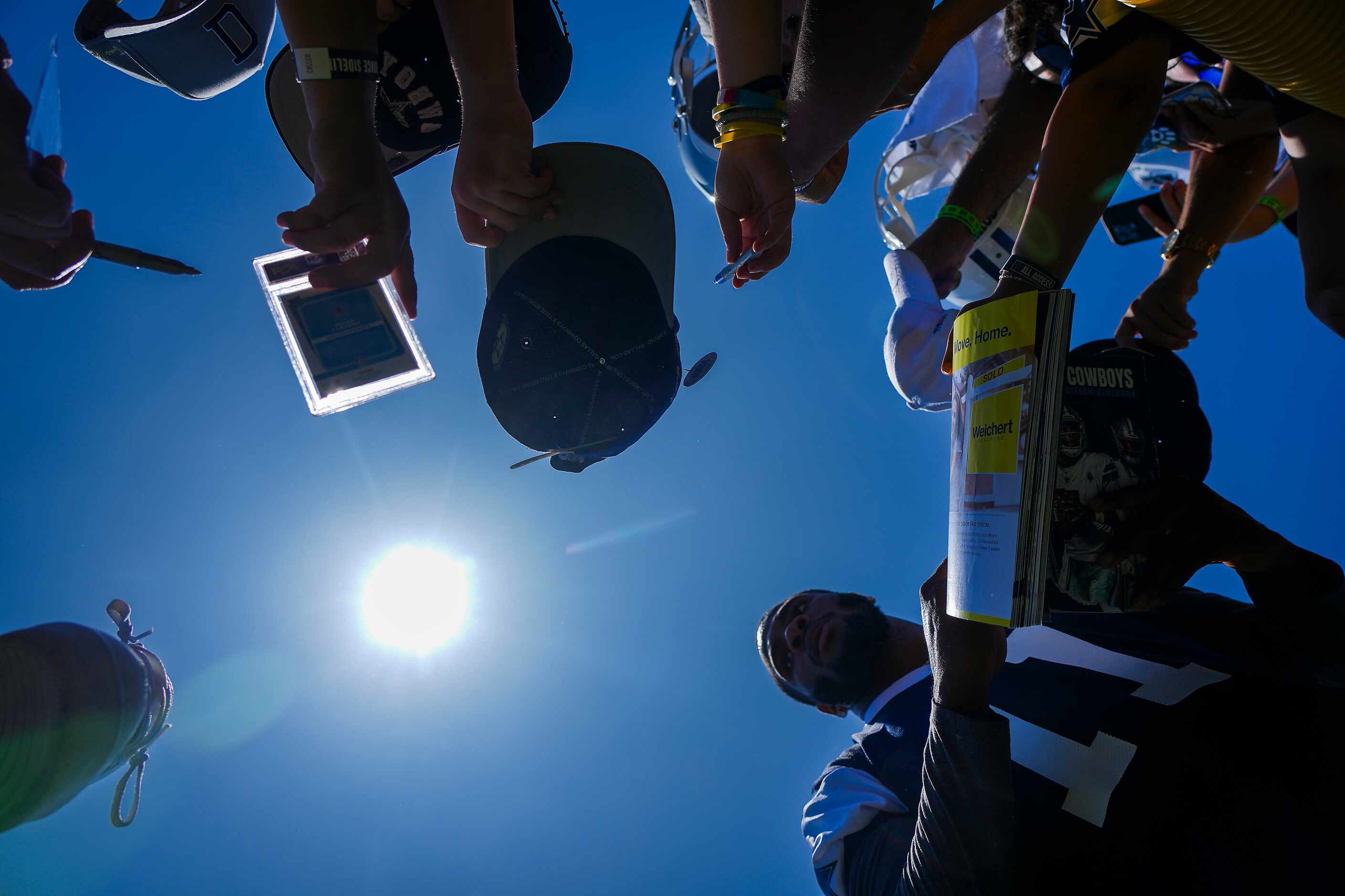 Dallas Cowboys linebacker Micah Parsons  signs autographs for fans following a training camp...