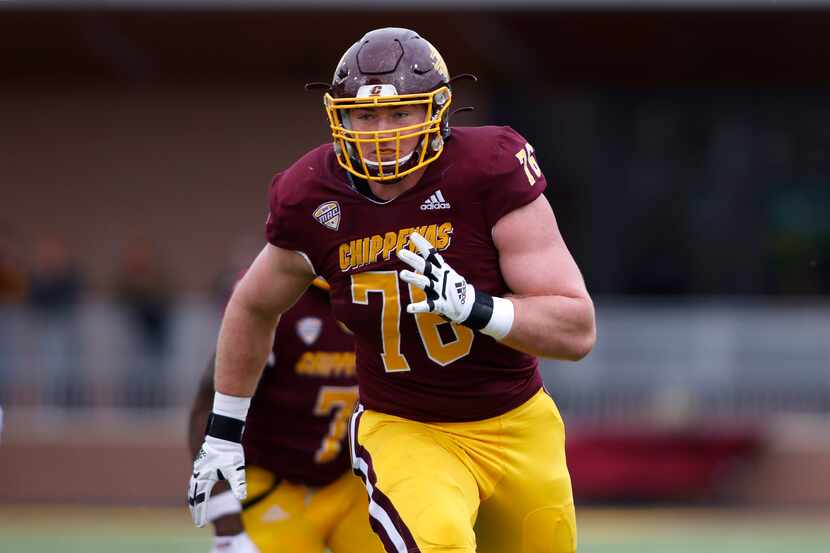 Central Michigan offensive lineman Bernhard Raimann plays during an NCAA college football...