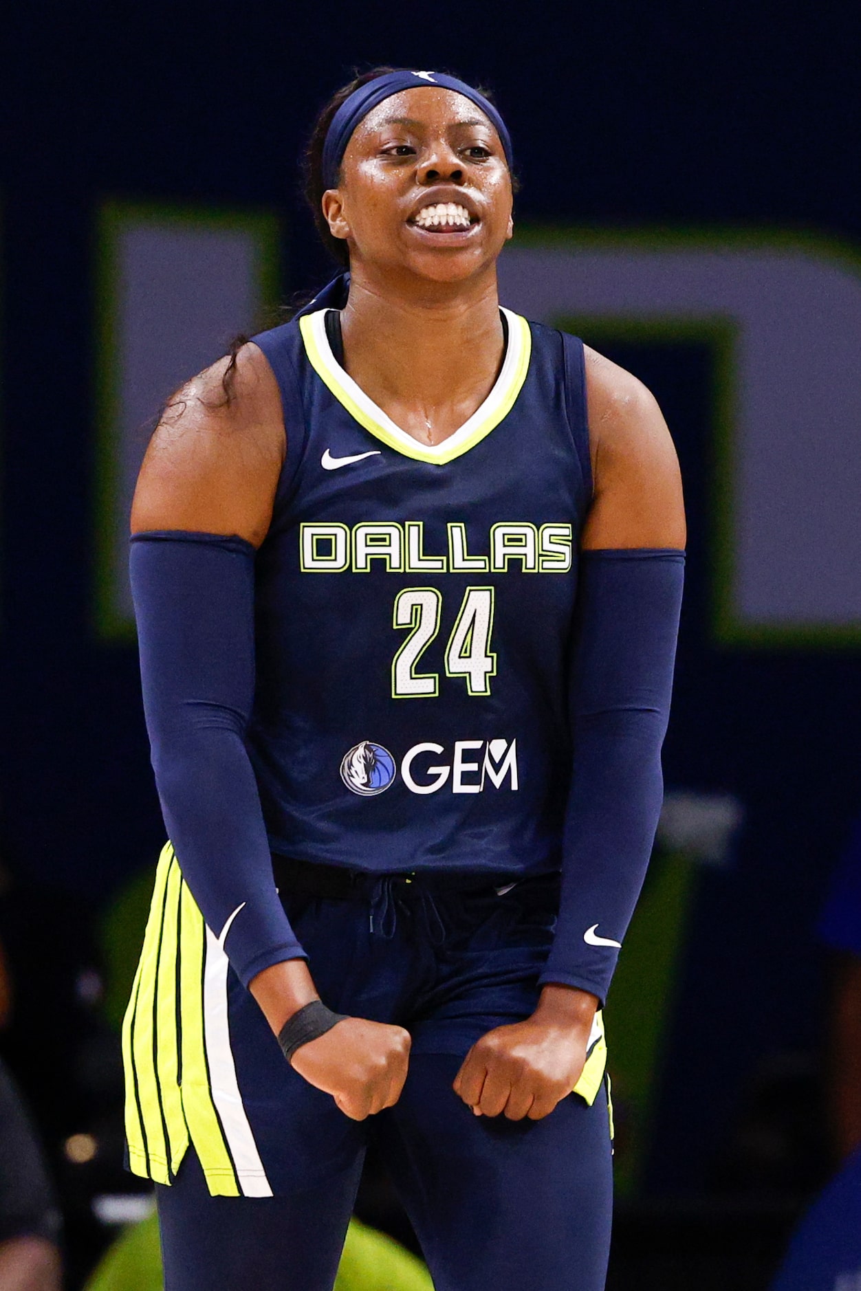 Dallas Wings guard Arike Ogunbowale (24) flexes after making a layup during the first half...