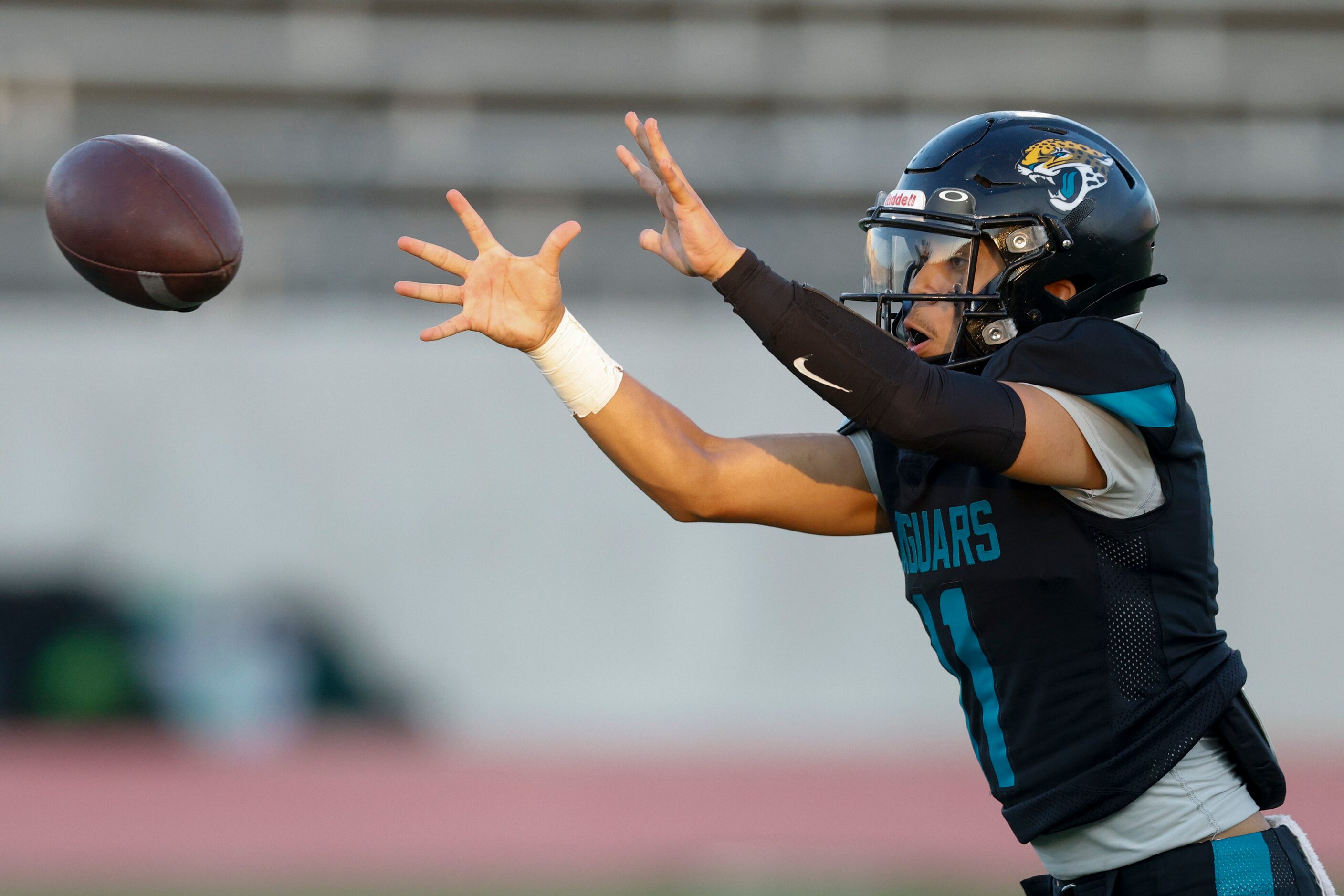 Molina quarterback Adan Ochoa (11) catches the ball after the snap during the first half of...