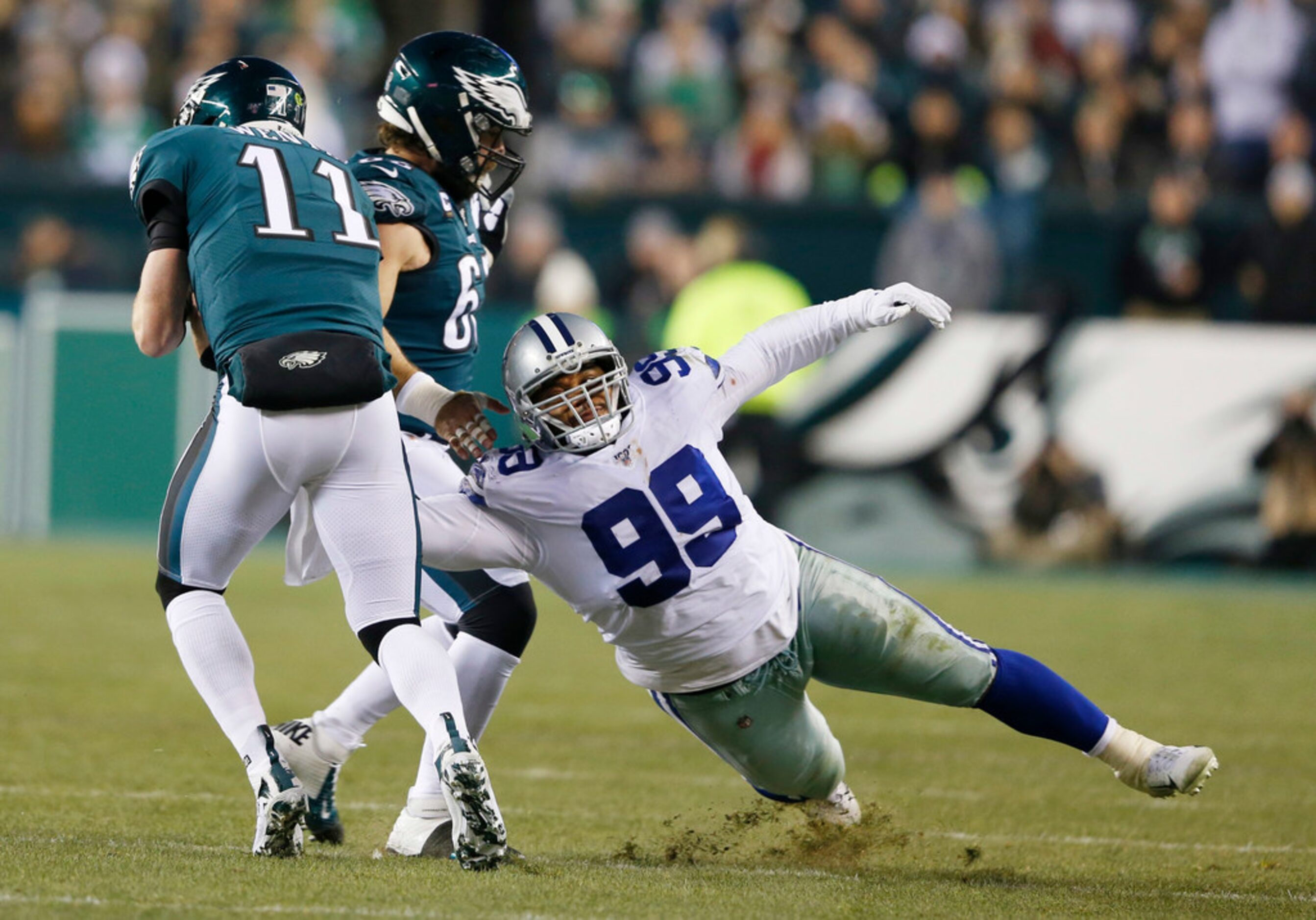 Dallas Cowboys defensive tackle Antwaun Woods (99) fails to stop Philadelphia Eagles...