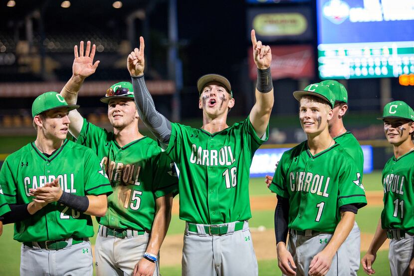 Southlake Carroll outfielder Brandon Howell (15) and infielder Austin Hale (16) wave to...