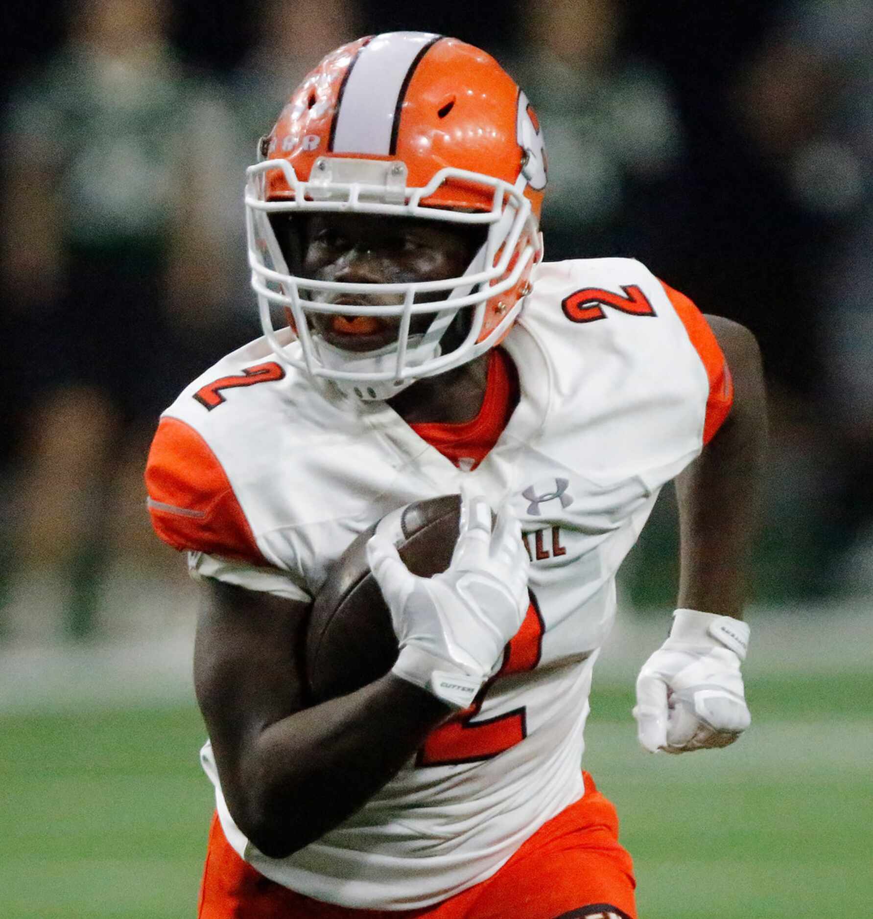 Rockwall High School running back Khalil Catlett (2) carris the ball during the first half...