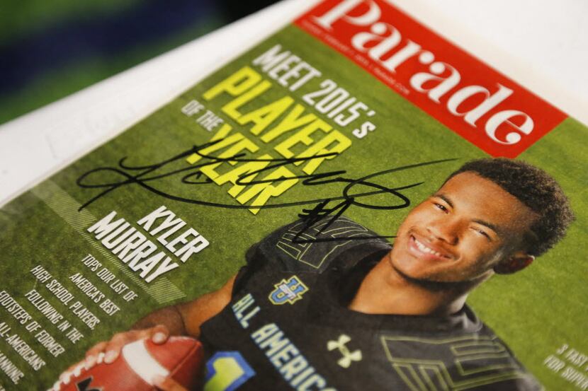 Allen quarterback Kyler Murray signed a magazine for a fan after Allen's National signing...