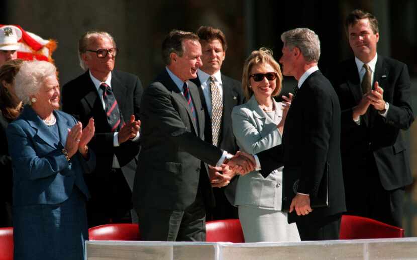 Former President George H.W. Bush and then-President  Bill Clinton shook hands at the ...